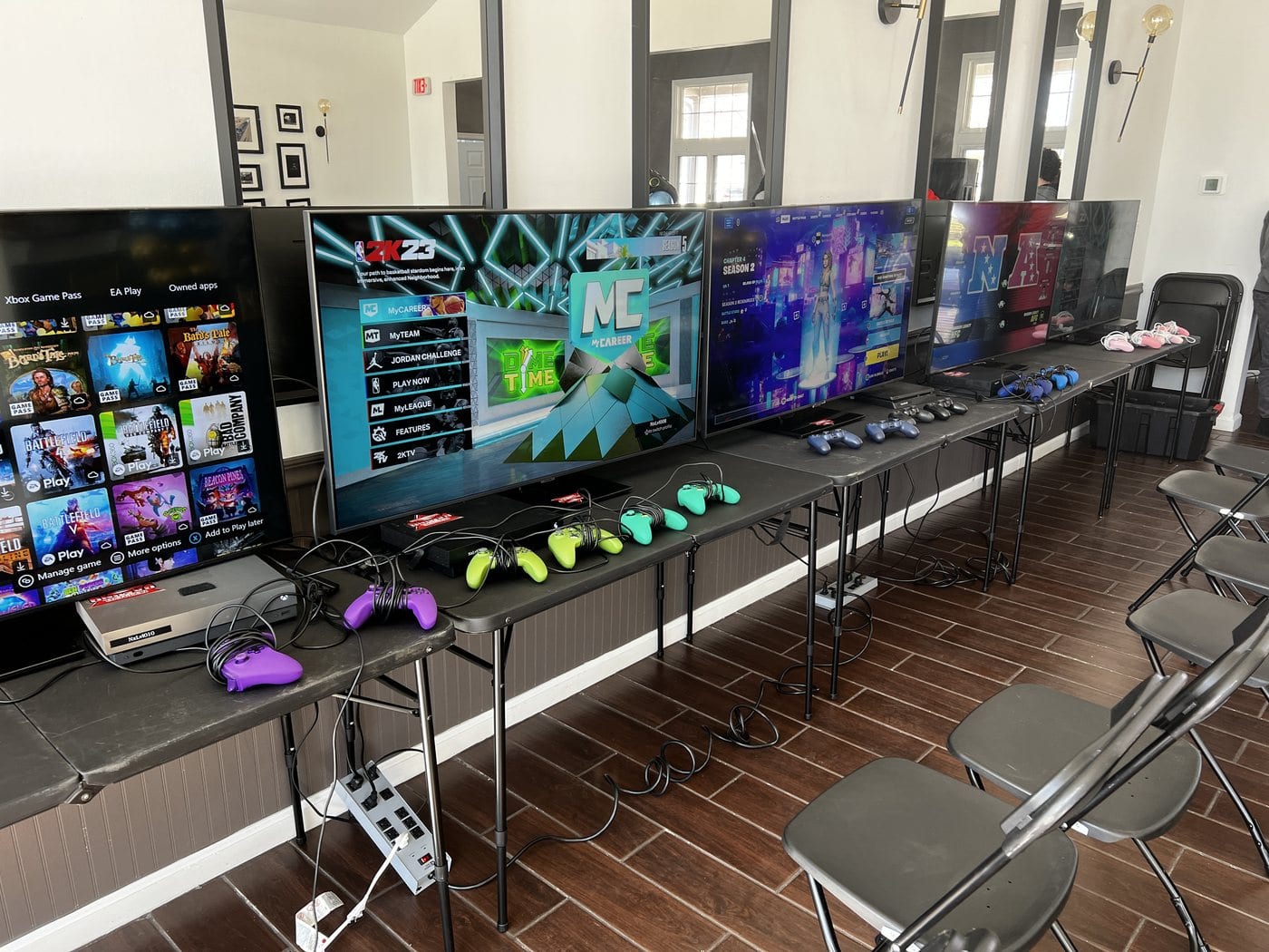 Gaming stations and monitors at a Next Level Gaming mobile arena in the DMV